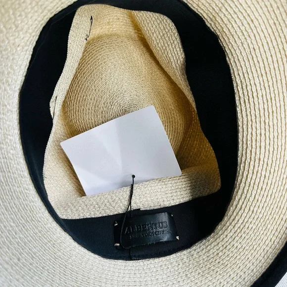 Albertus Swanepoel fedora. Natural raffia w/ shiny thread. Black satin band/bow. Women